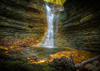 A small waterfall in rautal close to jena in thuringia at autumn