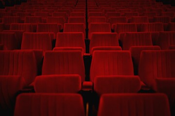Beautiful view of empty red theater seats- perfect for background and wallpaper use