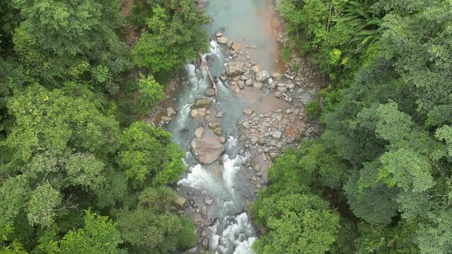 4K raising drone of trees and tropical waterfall in Perez Zeledon, Costa Rica