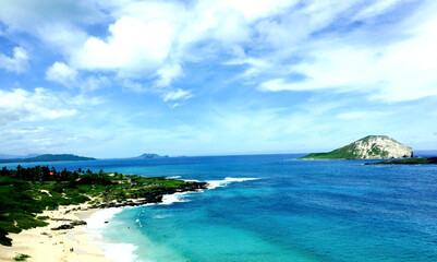 Fototapeta na wymiar Mesmerizing view of an island under a blue sky at daytime