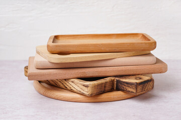 Different wooden cutting boards on white background