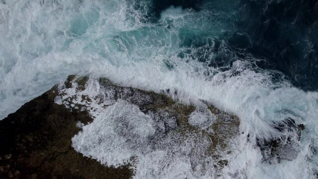 Cinematic 4k Drone Shot of the rough sea at the coast of Bali