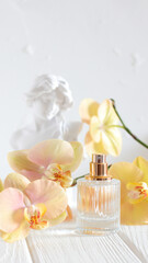Perfume glass bottle with orchid flowers and head sculpture head