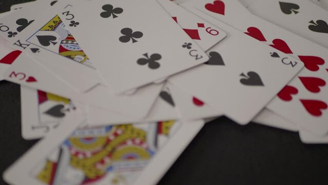 Multi-colored game cards falling on the black background