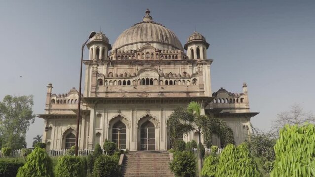 Tomb of Saadat Ali Khan in Lucknow City, India surrounded by lush green trees