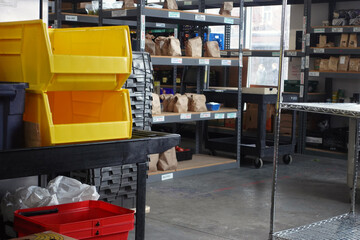 Bins, bags and shelves in a farmer’s market storage room or warehouse