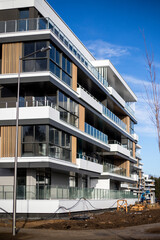 Fragment of modern residential apartment with flat buildings exterior. Detail of new luxury house and home complex