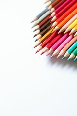 Vertical closeup shot of colorful pencils isolated on the white background