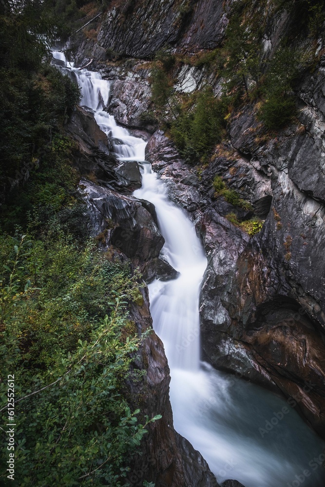 Wall mural vertical long exposure shot of the umbal falls, tyrol, austria