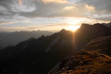 Aerial view of mountain landscape under blue sky