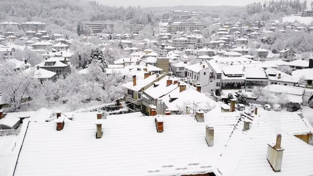 Aerial view of Tryavna buildings covered in snow, Bulgaria