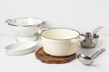 Set of different kitchen utensils on light background
