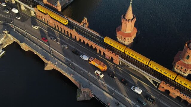 Drone view of traffic on the Oberbaum bridge over a river in Berlin, Germany