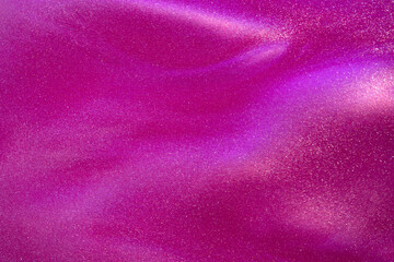 Fototapeta na wymiar Amazing silver particles in pink fluid. Sparkling glittering dust particles stains and overflows. Abstract liquid background with silver waves and magenta tints.