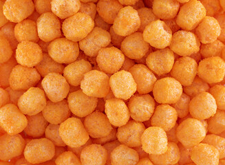 Cheese Corn balls. Texture, Pattern of Cheese flavored snack. Selective focus, food background....