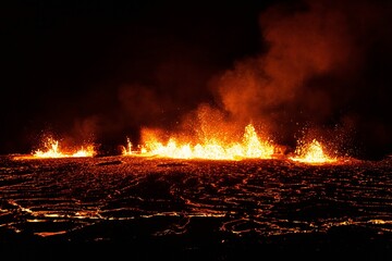 Aerial view of the volcano eruption at night