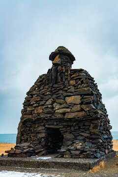 Vertical shot of the Bardur Saga Snaefellsas statue in Arnarstapi, Iceland