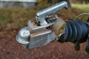 Closeup shot of a padlock on a trail in the woods