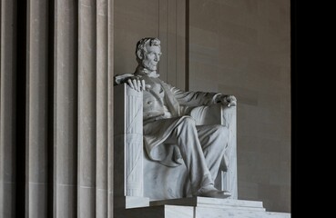 Low-angle shot of the stone Statue of Abraham Lincoln at Lincoln Memorial, Washington DC