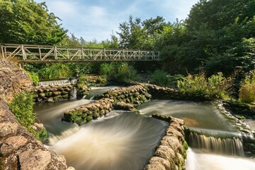 Long exposure of the water in the cascade of Bindslev, Fisketrappen in Denmark © Ron Jobing/Wirestock Creators