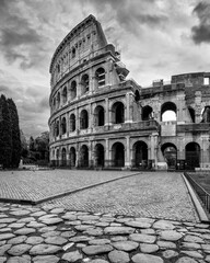 Grayscale shot of the Colosseum in Rome, Italy