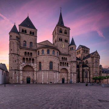 Amazing shot of Trier Saint Peter's Cathedral in Trier, Germany during pinky sunset