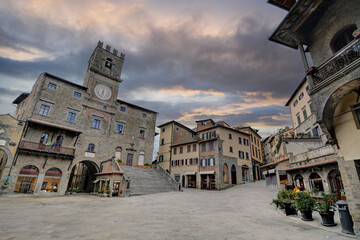 Piazza della Repubblica - the main square of the town of Cortona with a stormy clouds  - obrazy, fototapety, plakaty