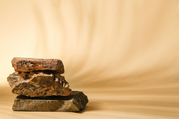Decorative stone podiums on beige background