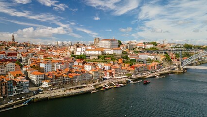 Fototapeta na wymiar Beautiful view of the cityscape on the coast of Douro river in Port, Portugal