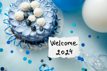 Welcome 2024 - card with text on blue background with cake and air balloons, new year concept with decoration	