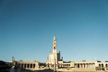 Fototapeta premium Sanctuary of Our Lady of Fatima in Portugal against a blue sky