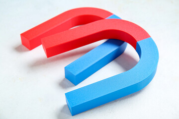 Horseshoe shaped magnets on white background