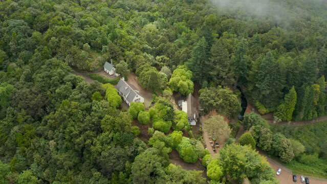Aerial shot of buildings in the middle of Queimadas Forest Park in Madeira Island, Portugal