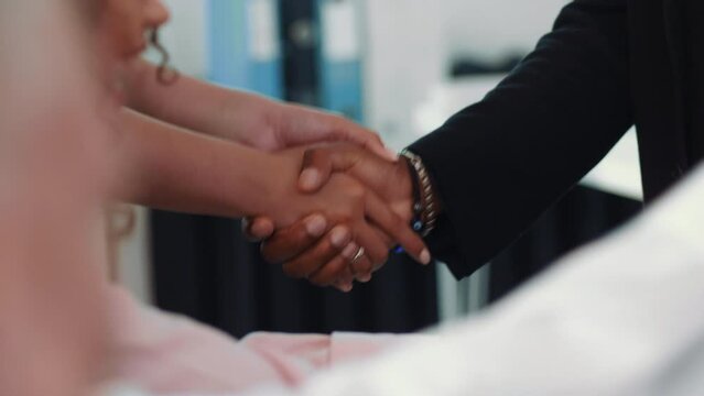 Close-up of female and male shaking hands in formal wear in slow motion