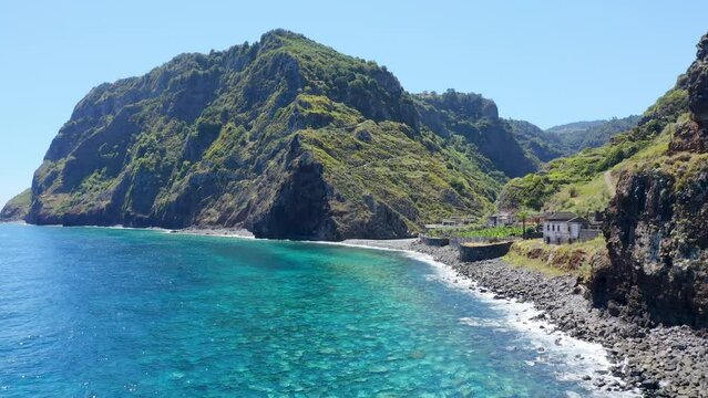 Drone view of Sao Jorge island coastline with crystal clear water