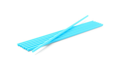 Blue plastic straws on white background