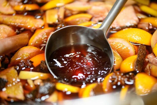 Closeup shot of a ladle in sweet fruit drink