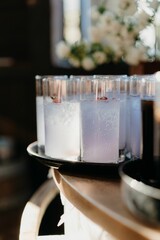Fototapeta na wymiar Vertical shot of fresh cocktails on the wooden table