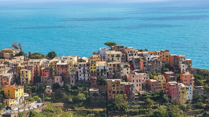 Aerial view of modern buildings near the sea in Cinque Terre, Italy