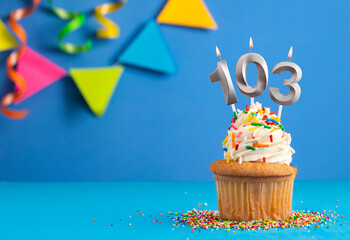 Candle number 103 - Cake birthday in blue background