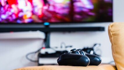 Closeup shot of a black joystick on the blurred background © Mustafa Kurnaz/Wirestock Creators