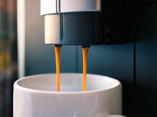 Close-up shot of espresso pouring from a coffee machine