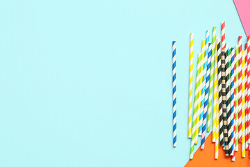 Fototapeta premium Different paper drinking straws on colorful background