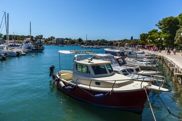 Fototapeta na wymiar Scenic view of the boats docked at the port of Krk city in Croatia