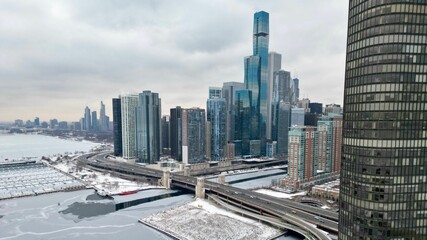Naklejka na ściany i meble Beautiful view of the Chicago skyline and winter coast under the cloudy sky