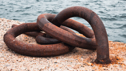 rusty anchor chain. Rusty mooring hook for boat on concrete, Isolated marin object