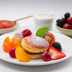 Fruit healhty breakfast of fluffy and soft Japanese pancakes on a white plate and white background