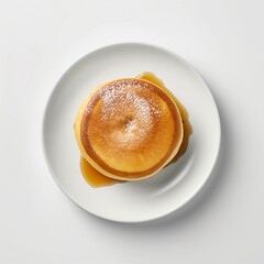 View from the top of fluffy and soft honoey Japanese pancakes on a white plate and white background