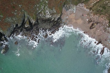 Obraz premium Aerial view of a deserted rocky coastline
