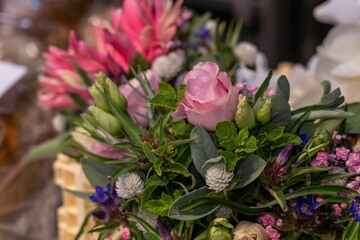 Closeup shot of a bouquet of flowers on a table in a restaurant